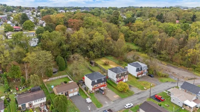 a view of a garden with tall buildings