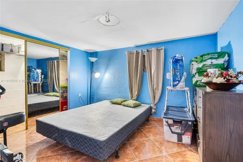 a room with a bed and a table in it