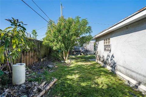 a view of a back yard of the house