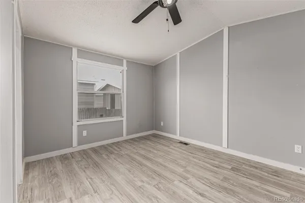 an empty room with a empty space and windows