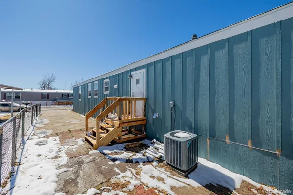 a view of a wooden floor and a sink in a backyard