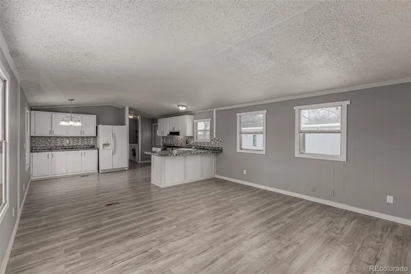 a view of kitchen with wooden floor