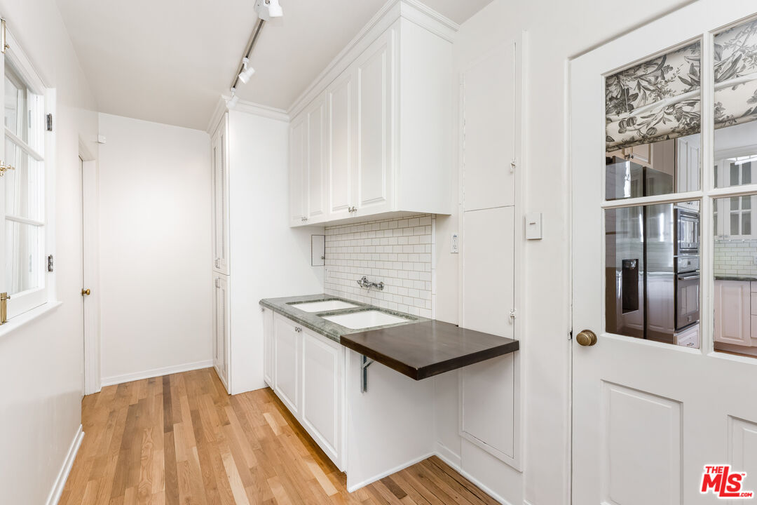 2120 Outpost Drive Los Angeles, CA 90068 - Photo 11 of 37 a kitchen with a sink and cabinets
