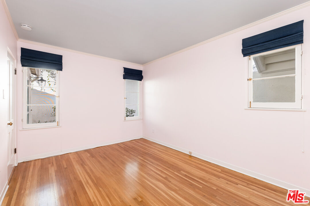 2120 Outpost Drive Los Angeles, CA 90068 - Photo 20 of 37 a view of empty room with wooden floor and fan