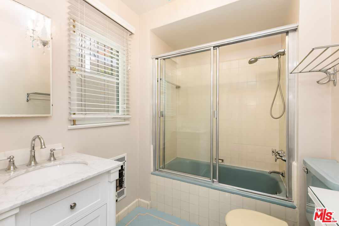 2120 Outpost Drive Los Angeles, CA 90068 - Photo 22 of 37 a bathroom with a shower sink vanity mirror and toilet