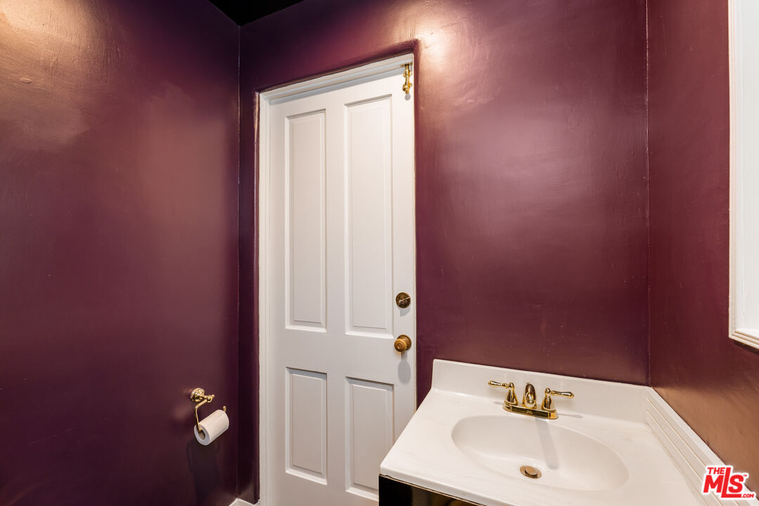 2120 Outpost Drive Los Angeles, CA 90068 - Photo 23 of 37 a bathroom with a sink and a mirror