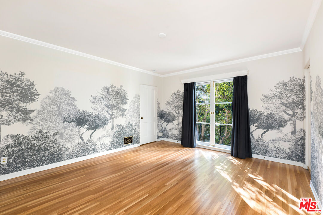 2120 Outpost Drive Los Angeles, CA 90068 - Photo 5 of 37 a view of a bedroom with a large window