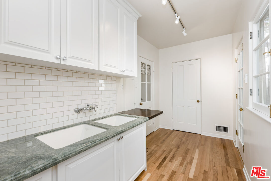 2120 Outpost Drive Los Angeles, CA 90068 - Photo 10 of 37 a kitchen with a sink and cabinets