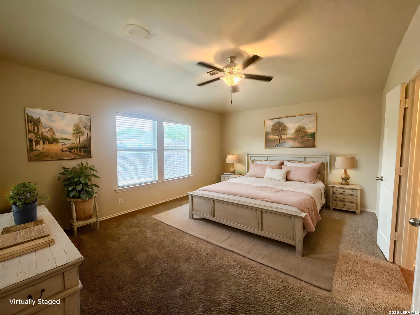 225 Brahma Way Cibolo, TX 78108 - Photo 12 of 24 a spacious bedroom with a bed and ceiling fan