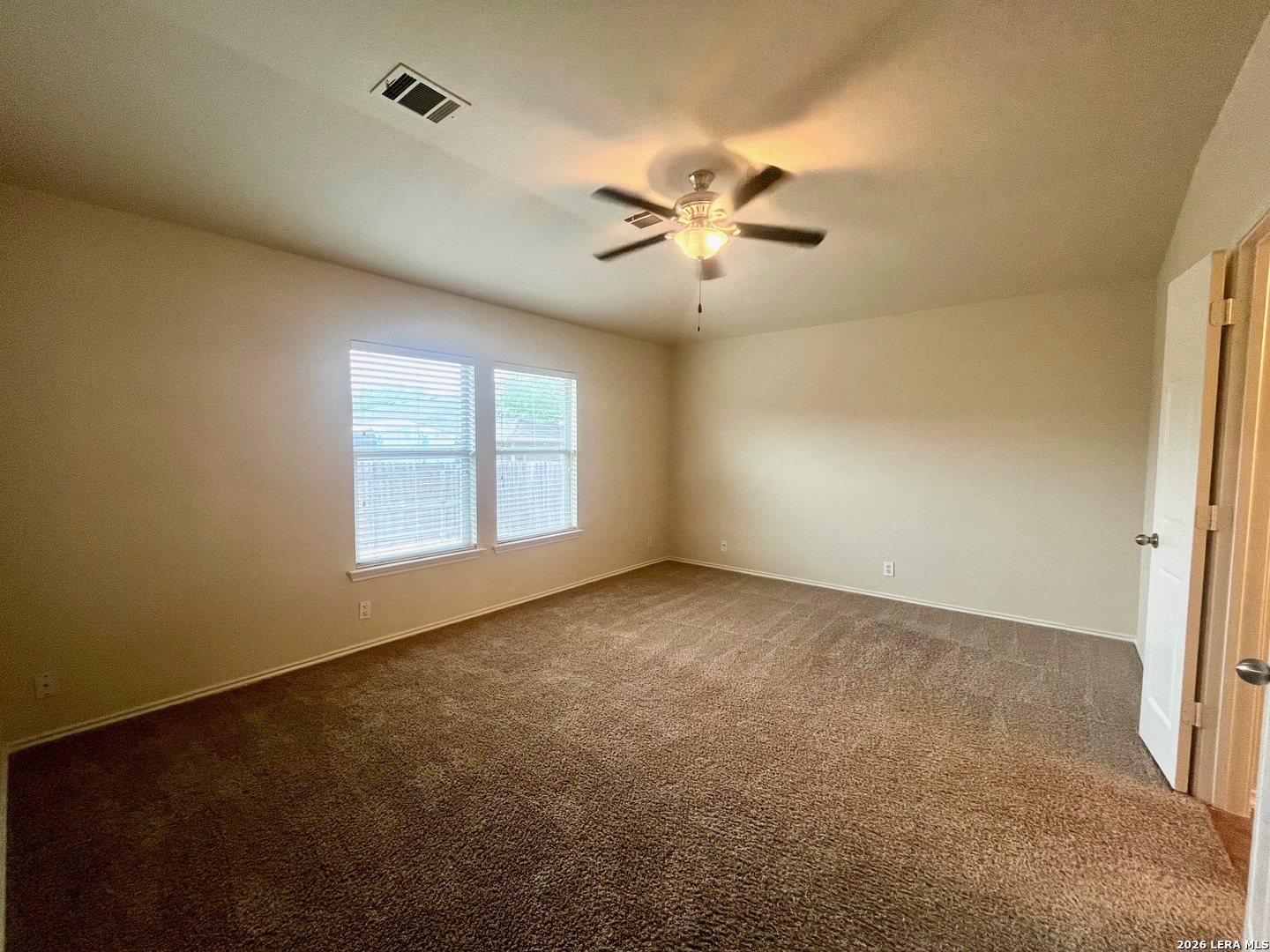 225 Brahma Way Cibolo, TX 78108 - Photo 13 of 24 a view of an empty room with a window