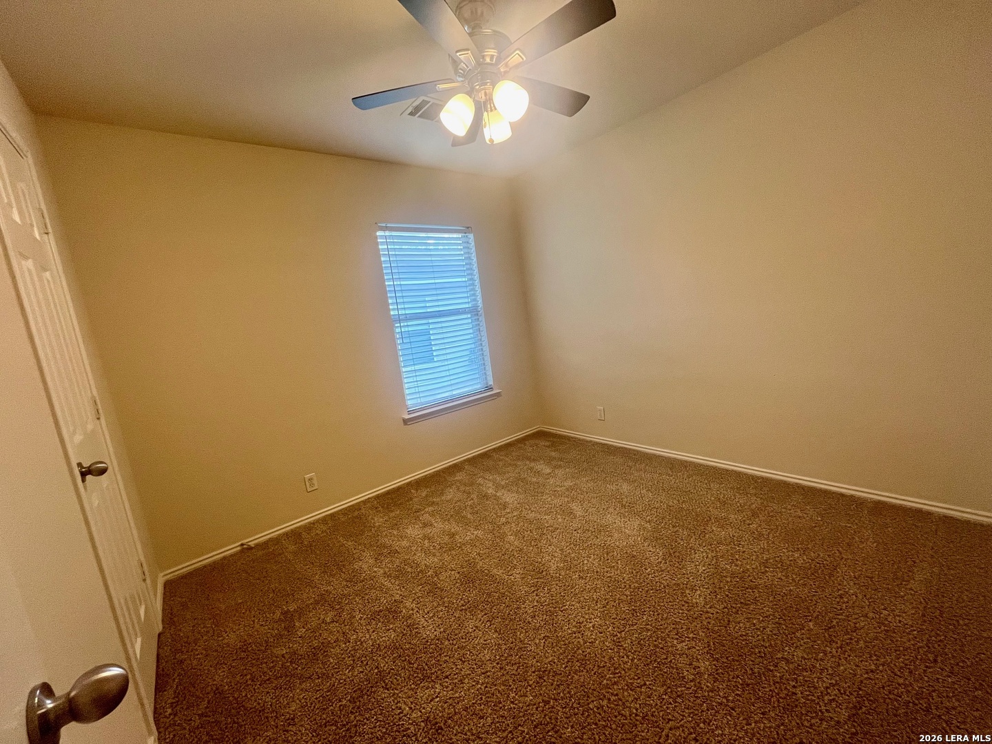 225 Brahma Way Cibolo, TX 78108 - Photo 23 of 24 an empty room with a fan & a window