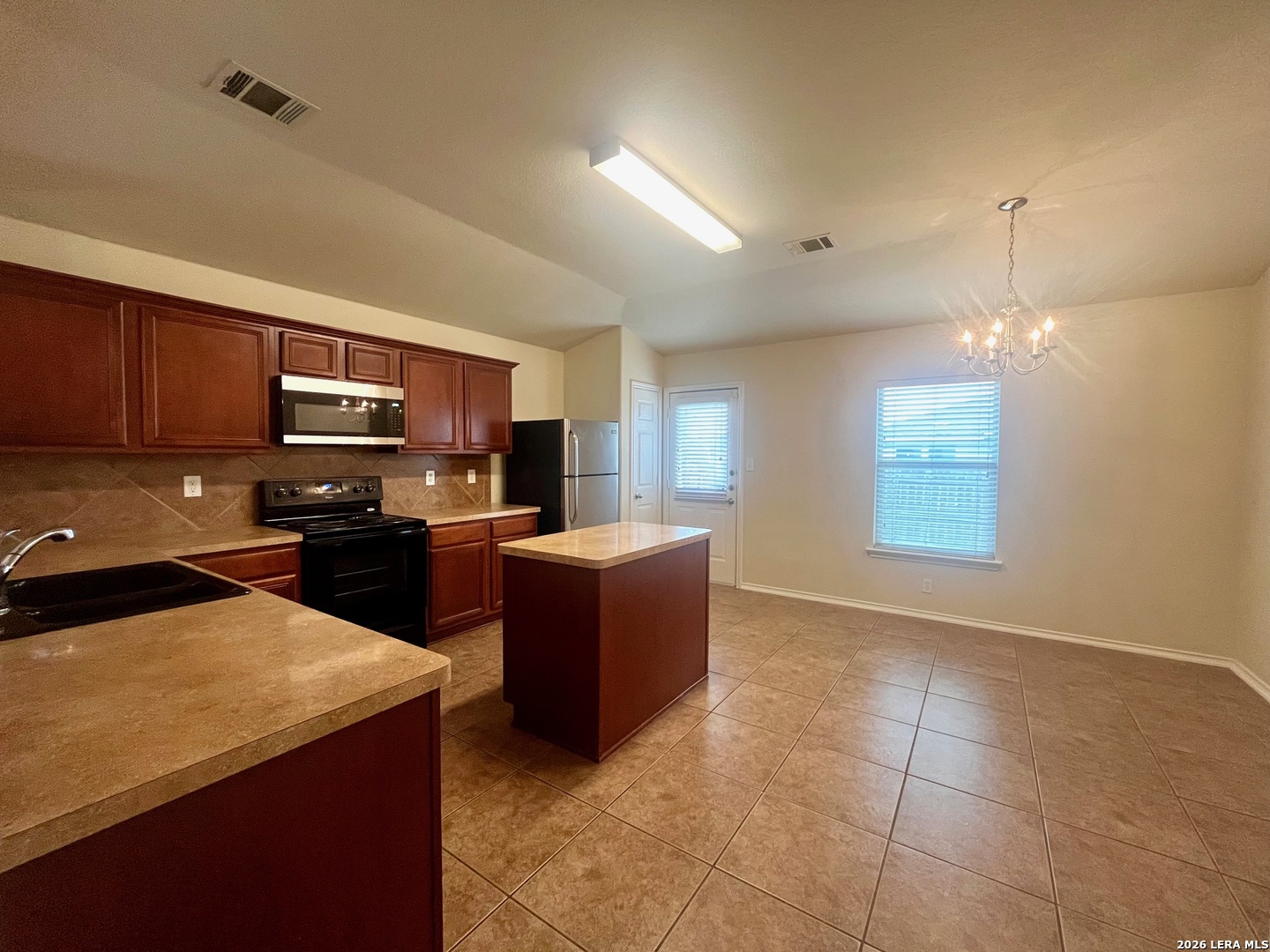 225 Brahma Way Cibolo, TX 78108 - Photo 10 of 24 a kitchen with stainless steel appliances granite countertop a stove top oven a sink a counter top space and cabinets