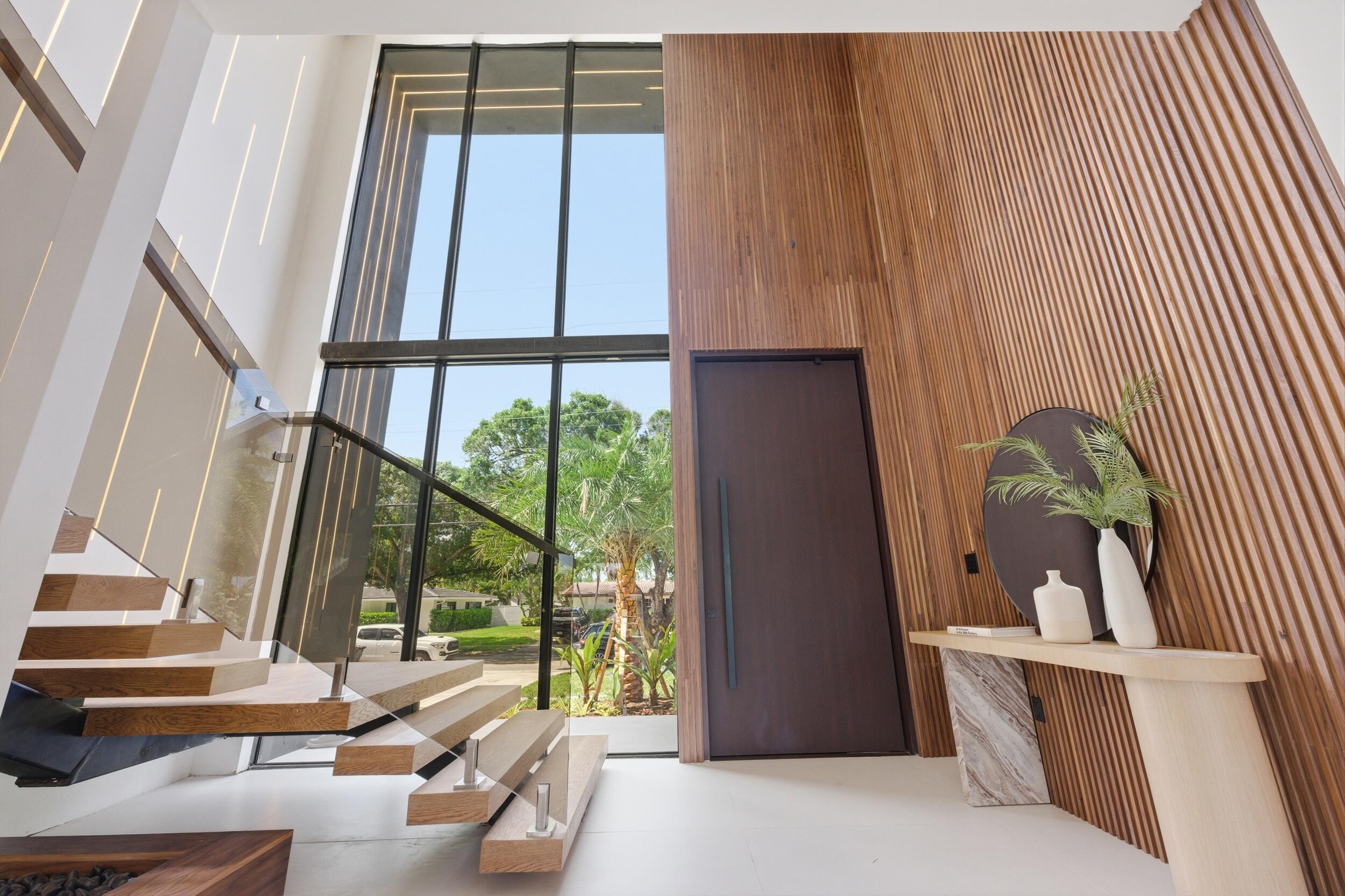 2360 Northeast 49th Street Lighthouse Point, FL 33064 - Photo 6 of 66 a living room with a large window