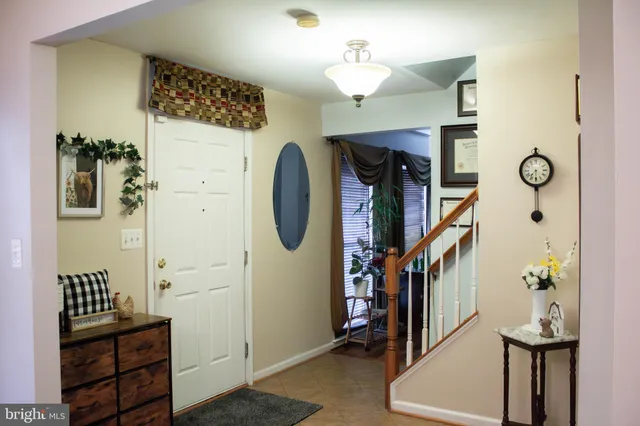 a living room with a rug floor and a table