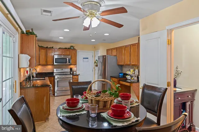 a kitchen with stainless steel appliances a sink stove and refrigerator