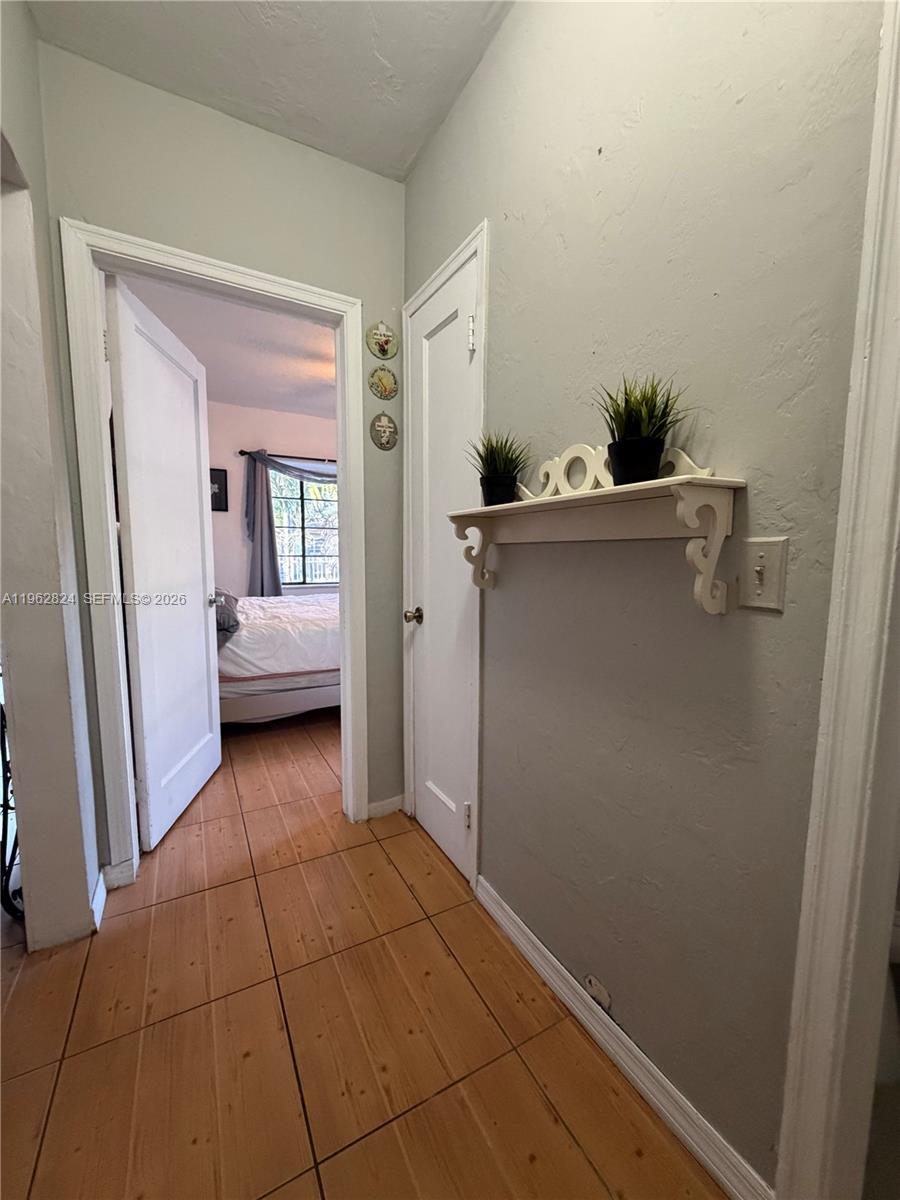 2460 Northwest 33rd Street Miami, FL 33142 - Photo 18 of 33 a view of a room with an empty space and a hallway