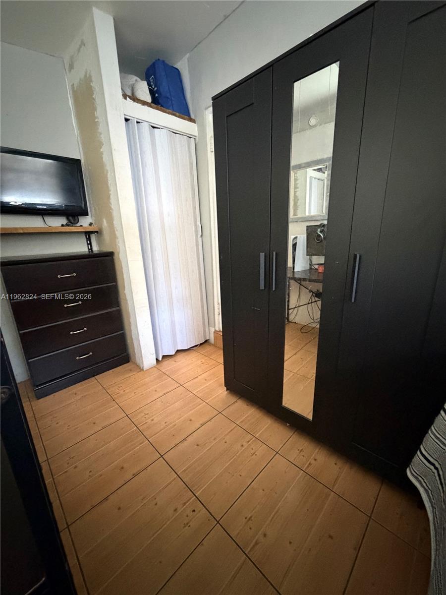 2460 Northwest 33rd Street Miami, FL 33142 - Photo 28 of 33 a view of an empty room and a kitchen