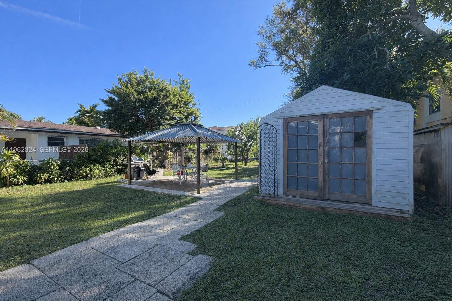 2460 Northwest 33rd Street Miami, FL 33142 - Photo 31 of 33 a view of a back yard of the house