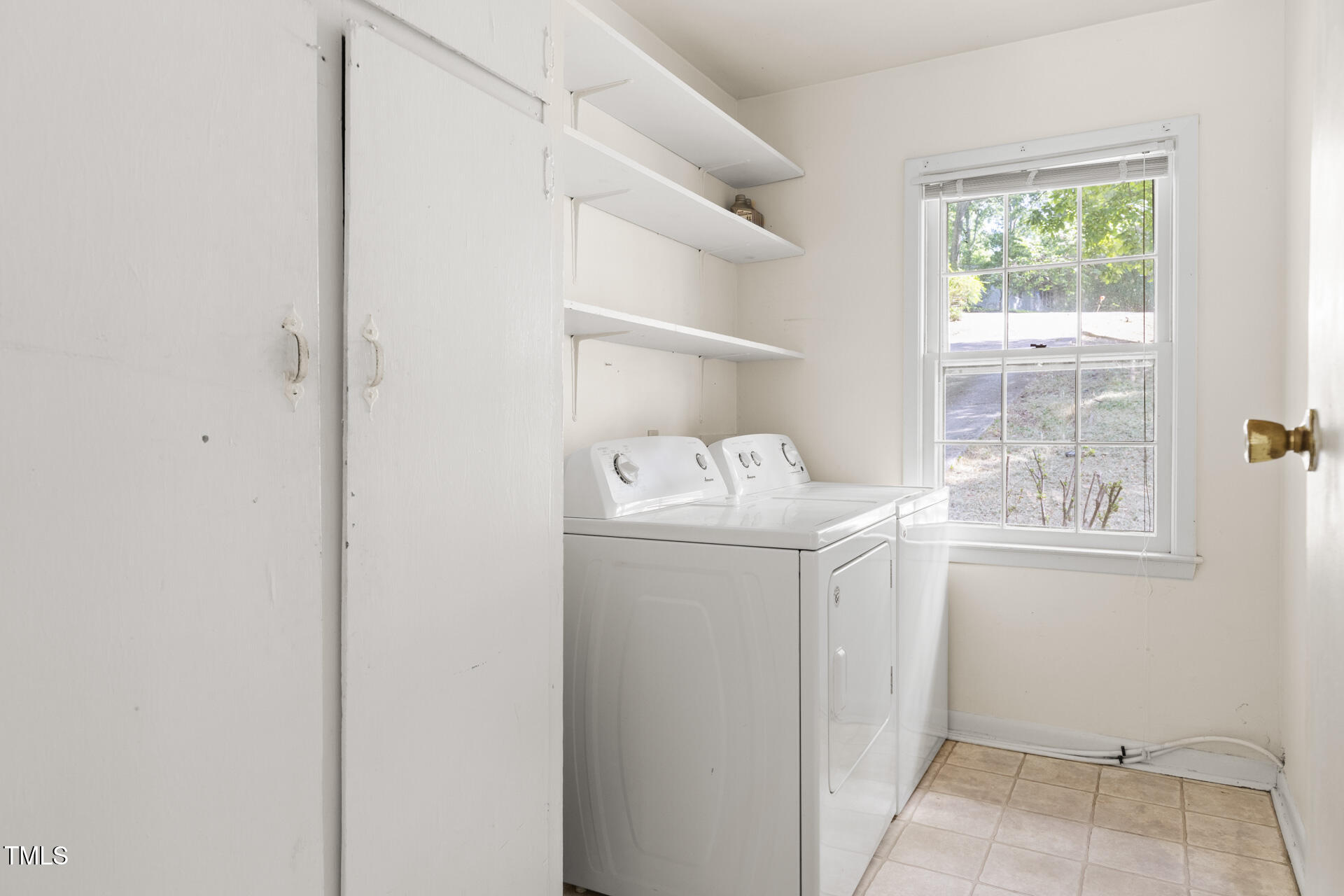 324 Woodhaven Road Chapel Hill, NC 27514 - Photo 16 of 32 a utility room with dryer and washer