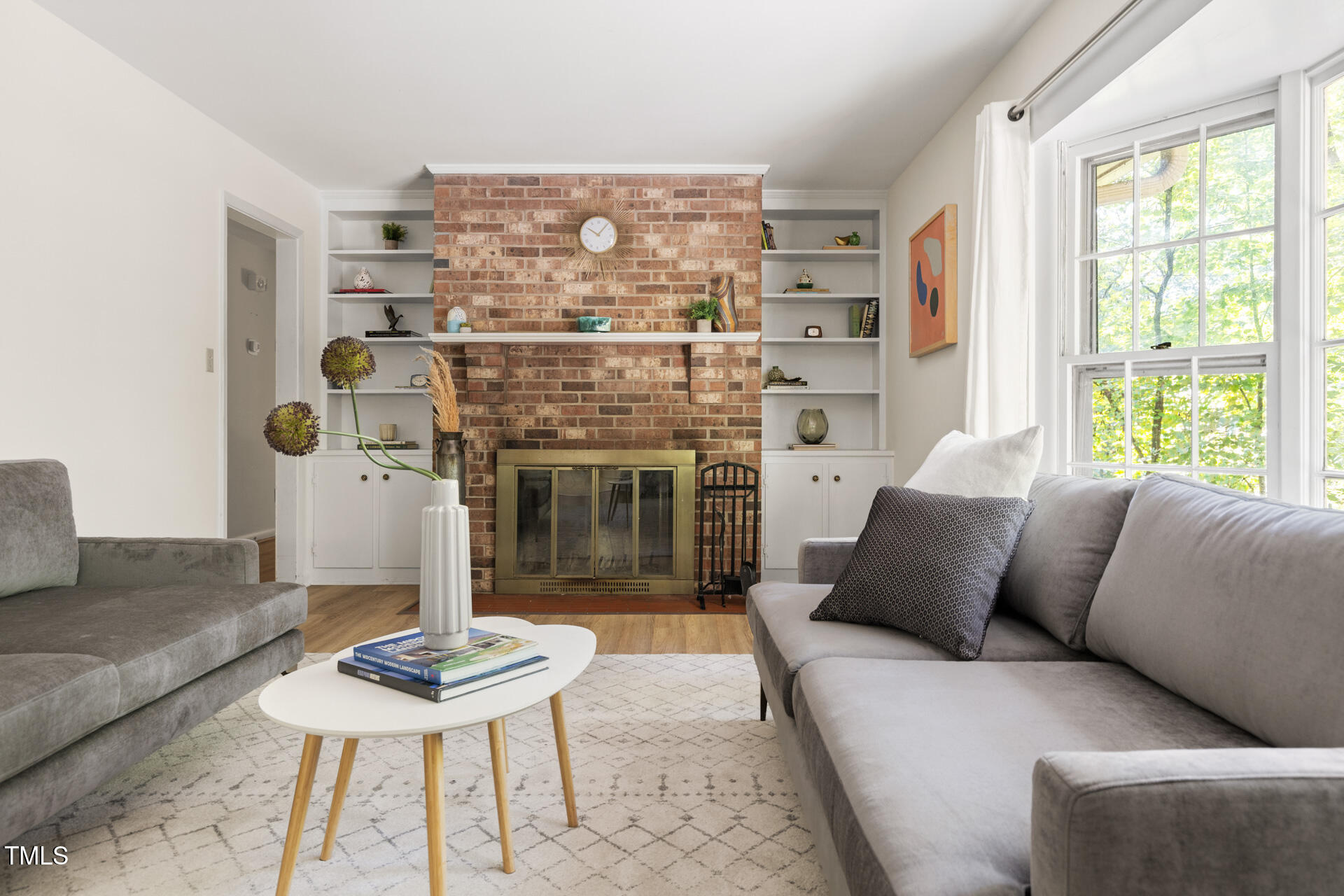 324 Woodhaven Road Chapel Hill, NC 27514 - Photo 18 of 32 a living room with furniture and a fireplace