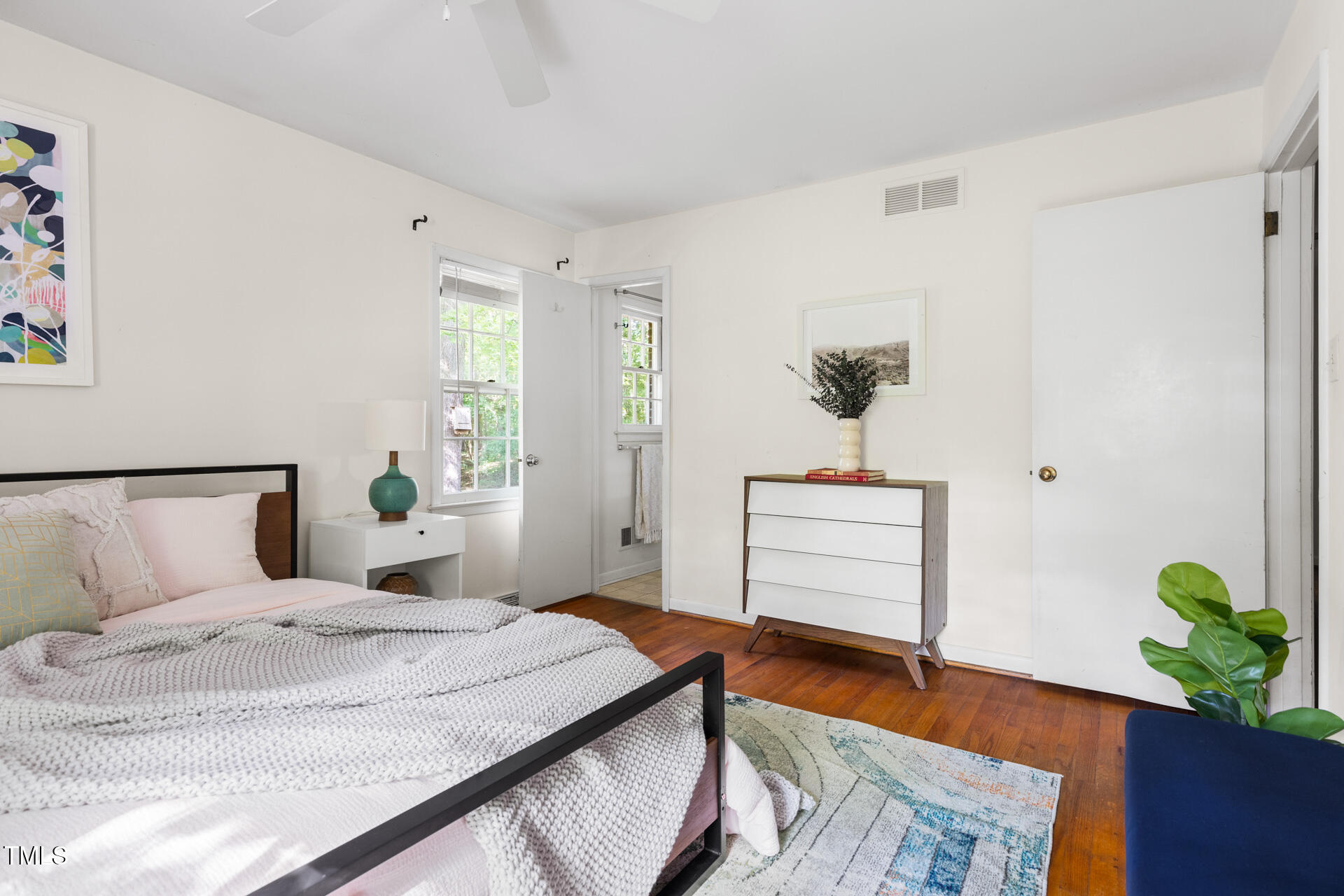 324 Woodhaven Road Chapel Hill, NC 27514 - Photo 22 of 32 a bedroom with a bed and a potted plant