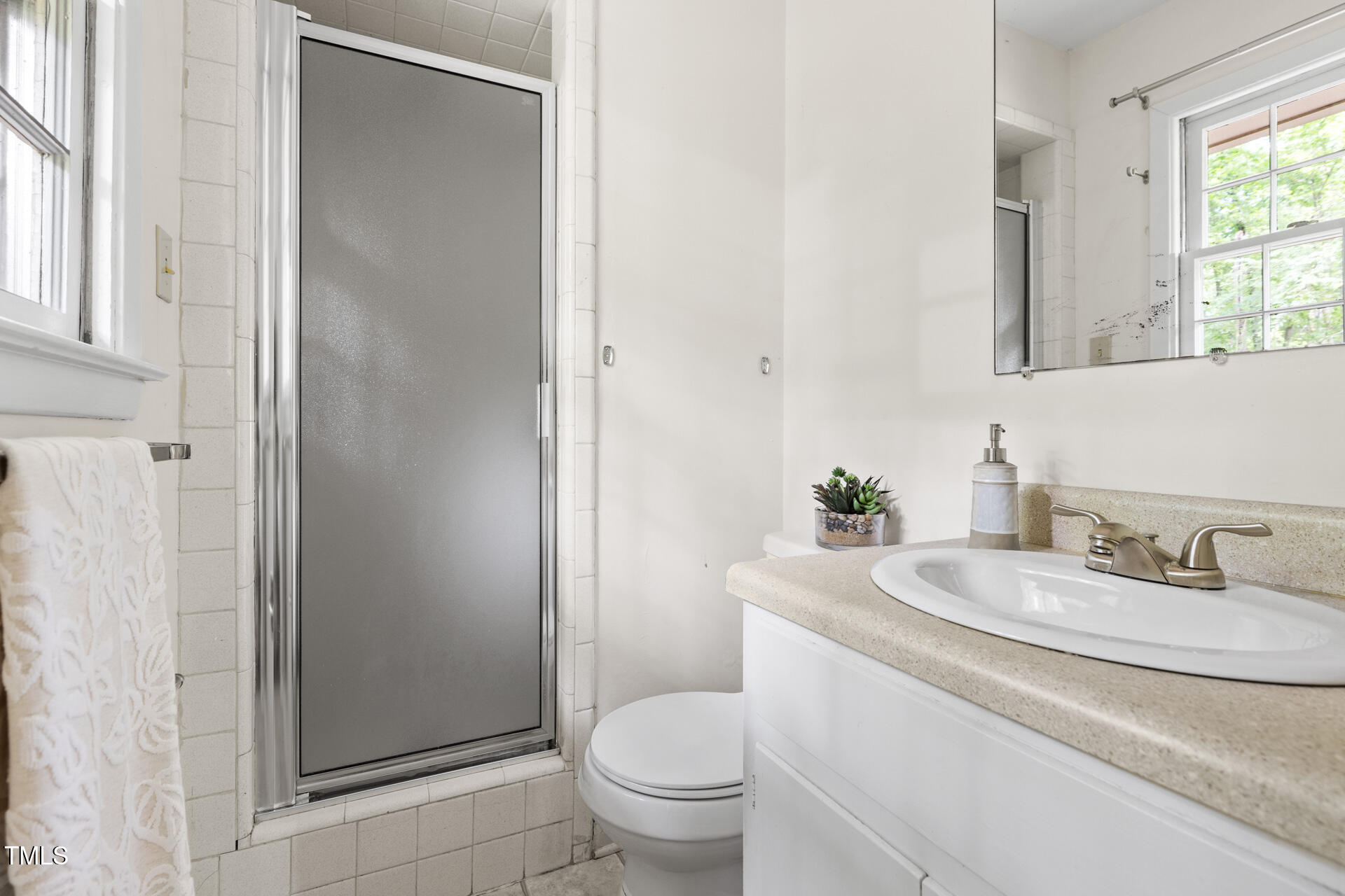324 Woodhaven Road Chapel Hill, NC 27514 - Photo 23 of 32 a bathroom with a granite countertop sink toilet and shower