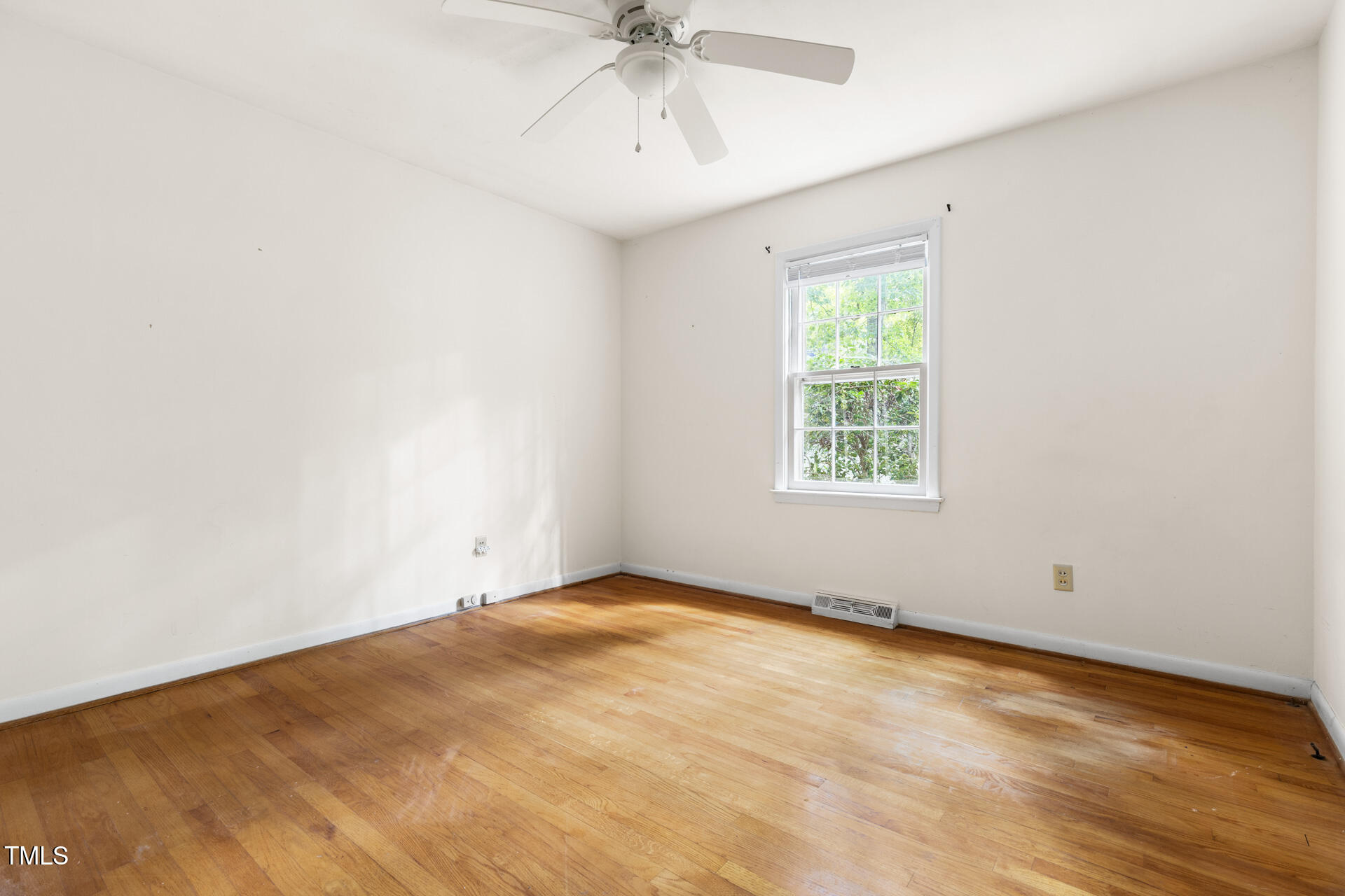 324 Woodhaven Road Chapel Hill, NC 27514 - Photo 24 of 32 an empty room with a window and a ceiling fan