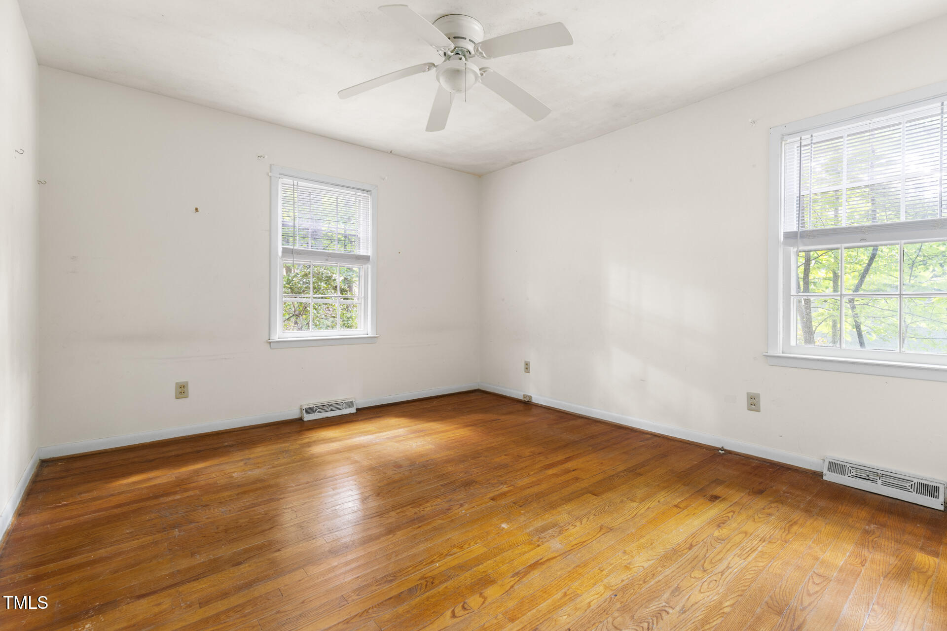 324 Woodhaven Road Chapel Hill, NC 27514 - Photo 26 of 32 an empty room with a window and a ceiling fan