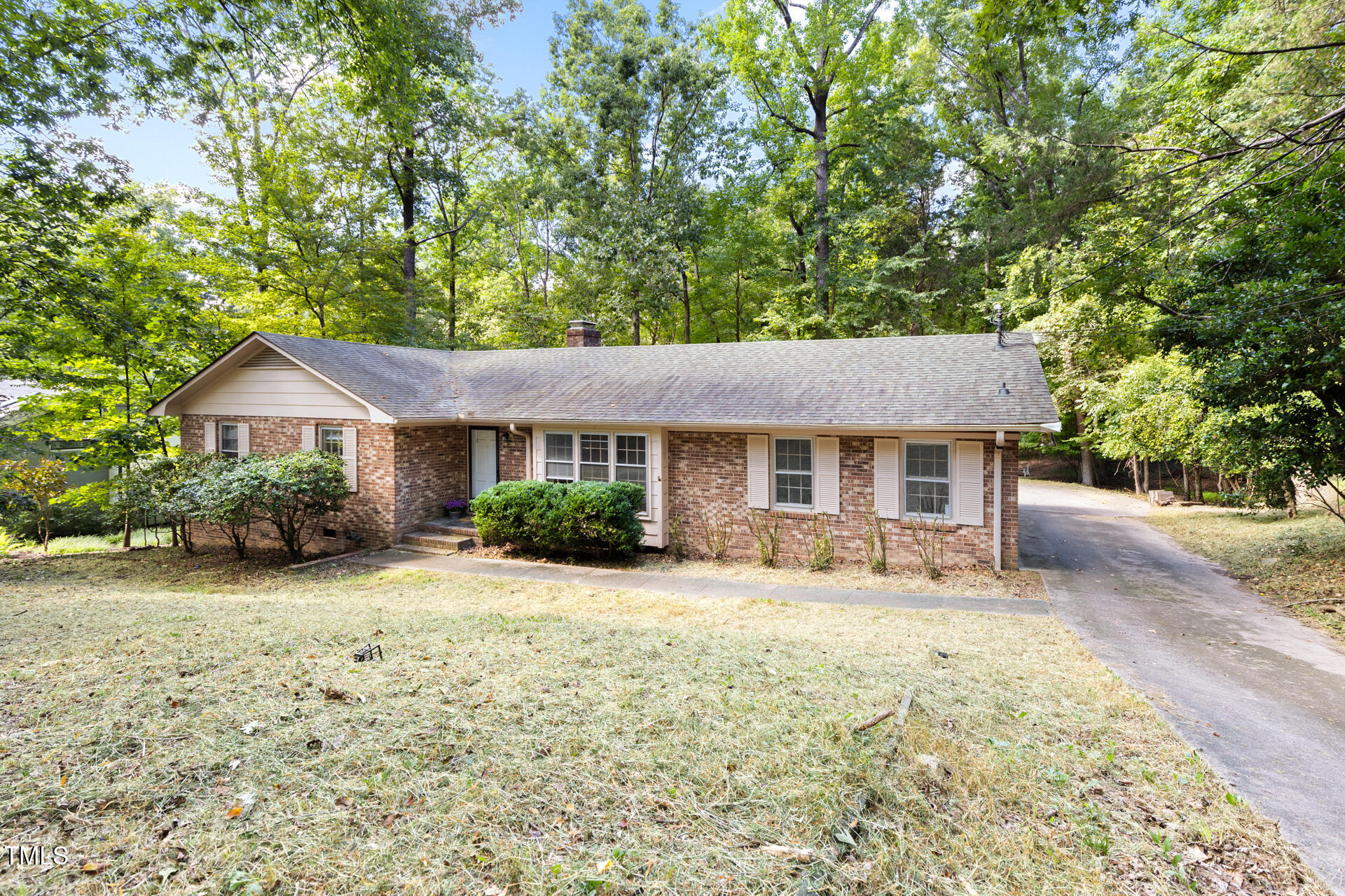 324 Woodhaven Road Chapel Hill, NC 27514 - Photo 30 of 32 a front view of a house with yard patio and fire pit