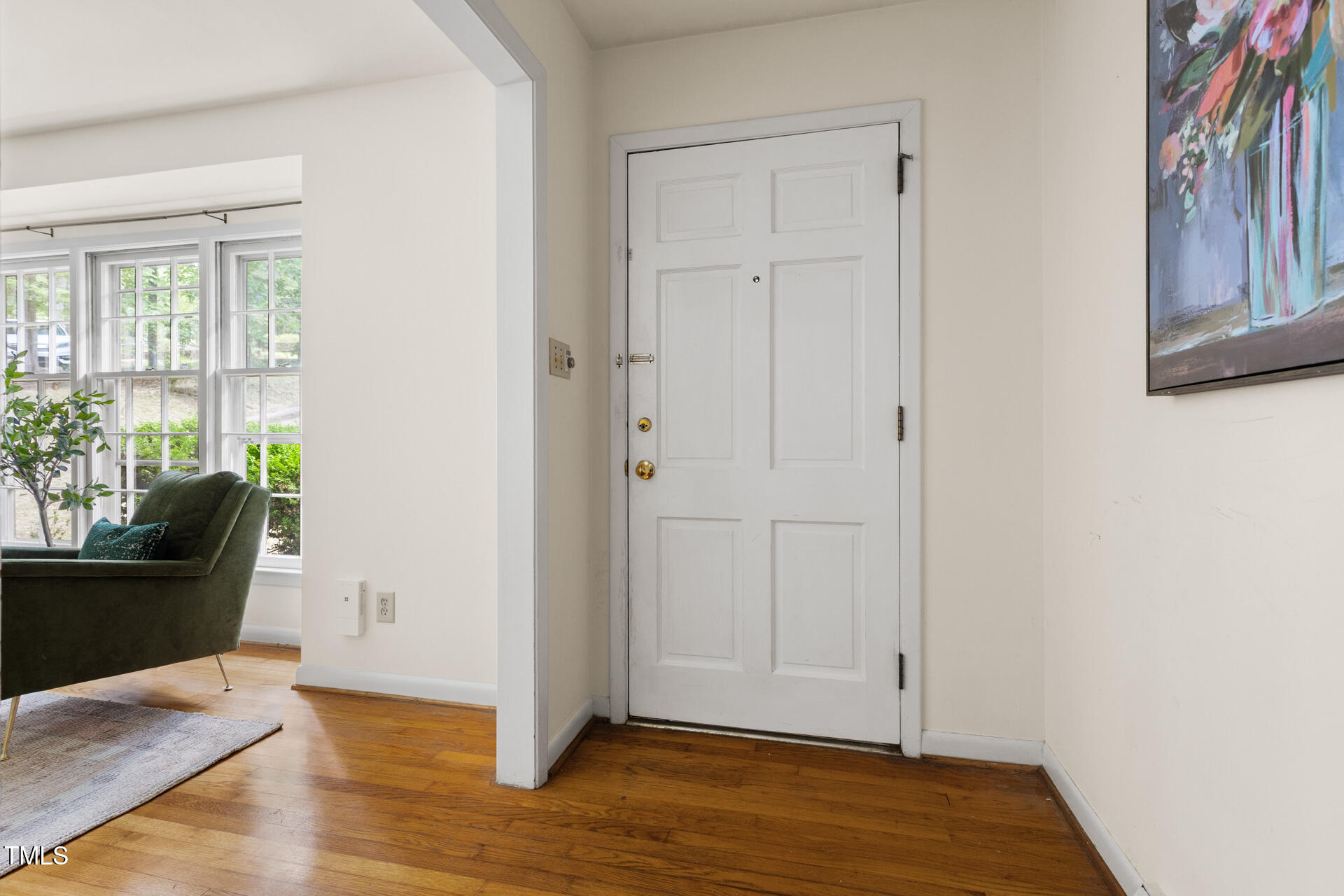 324 Woodhaven Road Chapel Hill, NC 27514 - Photo 3 of 32 an empty room with wooden floor and windows