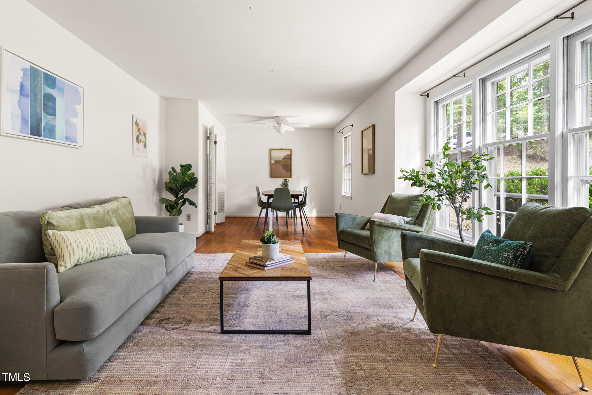324 Woodhaven Road Chapel Hill, NC 27514 - Photo 4 of 32 a living room with furniture kitchen view and large windows