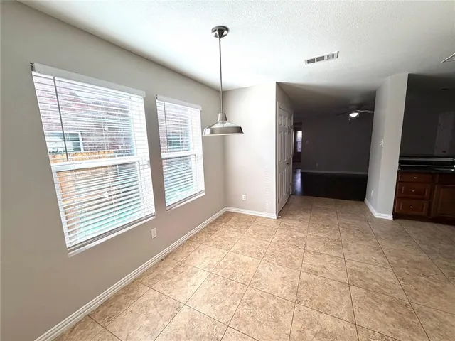 a view of a kitchen with a sink and a window