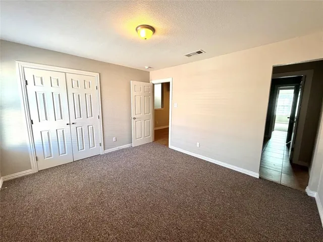a view of an empty room with a fireplace