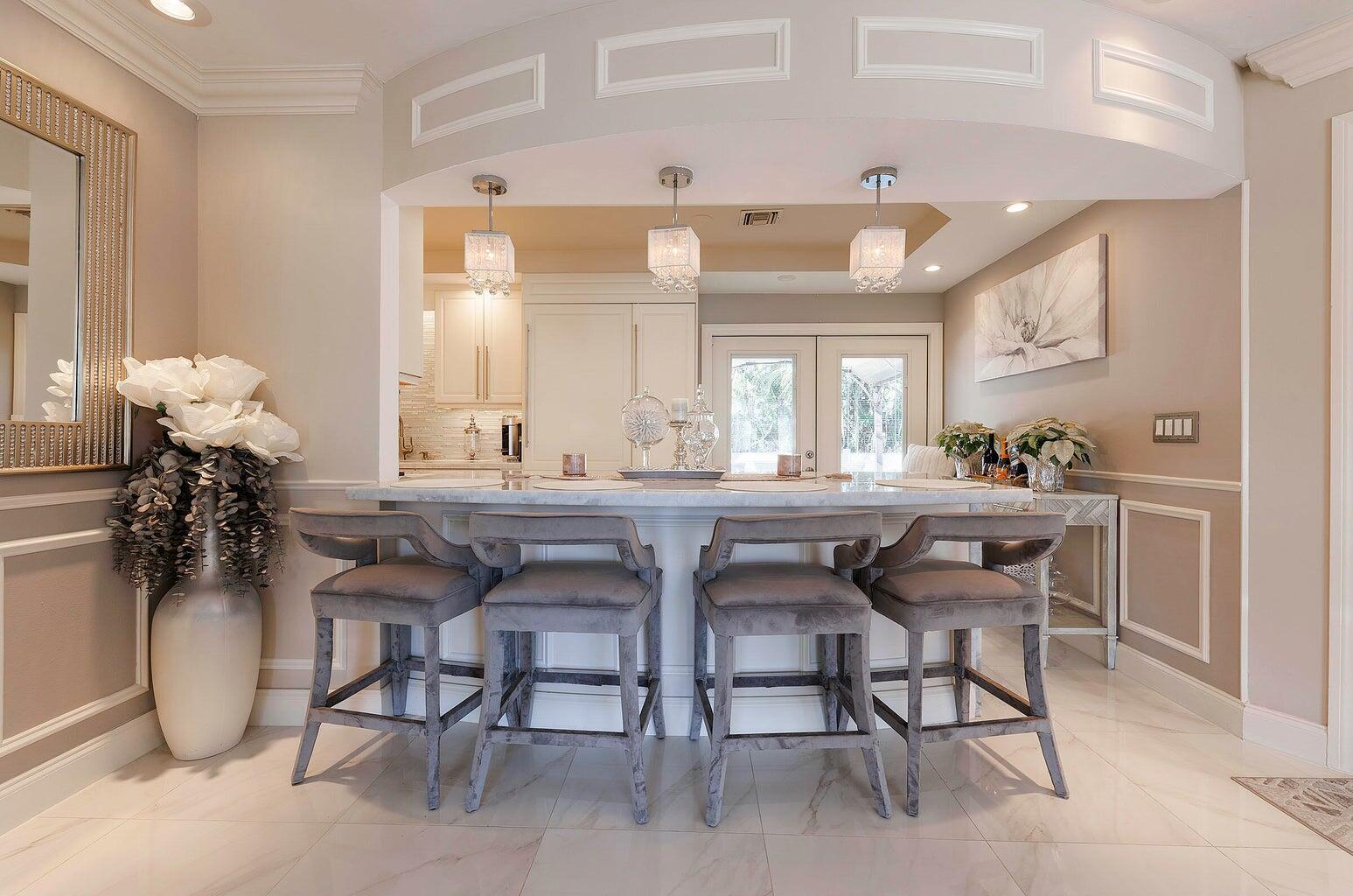 2935 Lake Worth Road Palm Springs, FL 33461 - Photo 10 of 22 a dining room with furniture and a potted plant