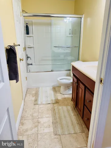 a bathroom with a bathtub and shower