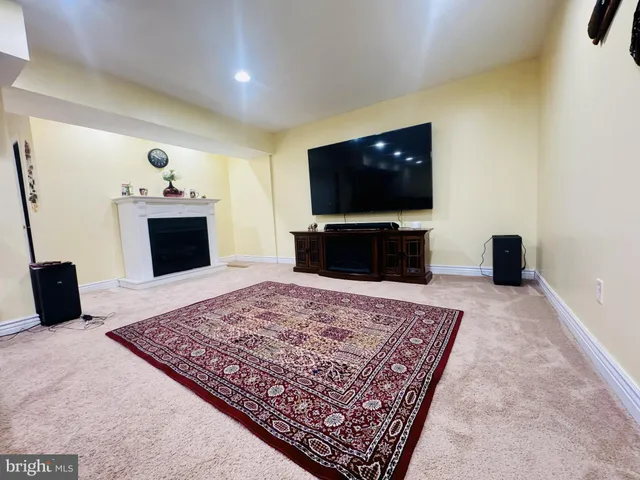 a living room with a couch and a flat screen tv
