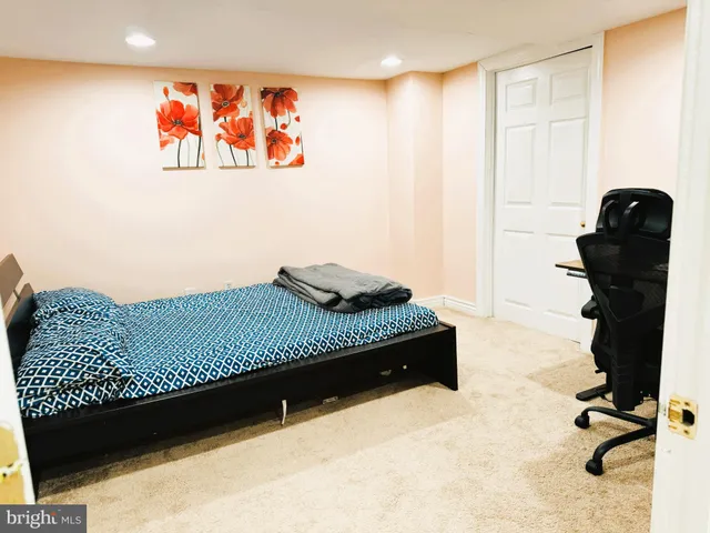 a bedroom with a bed and furniture