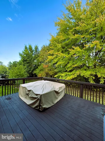 a view of a balcony with wooden floor