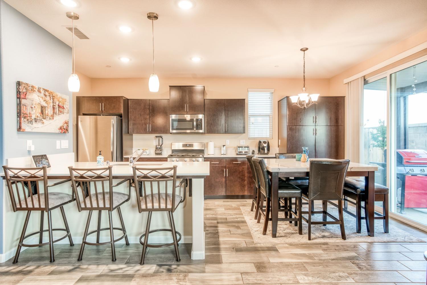 3678 Parkstone Way Clovis, CA 93619 - Photo 6 of 34 a view of a dining room with furniture