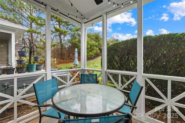 a view of a chairs and table in the balcony