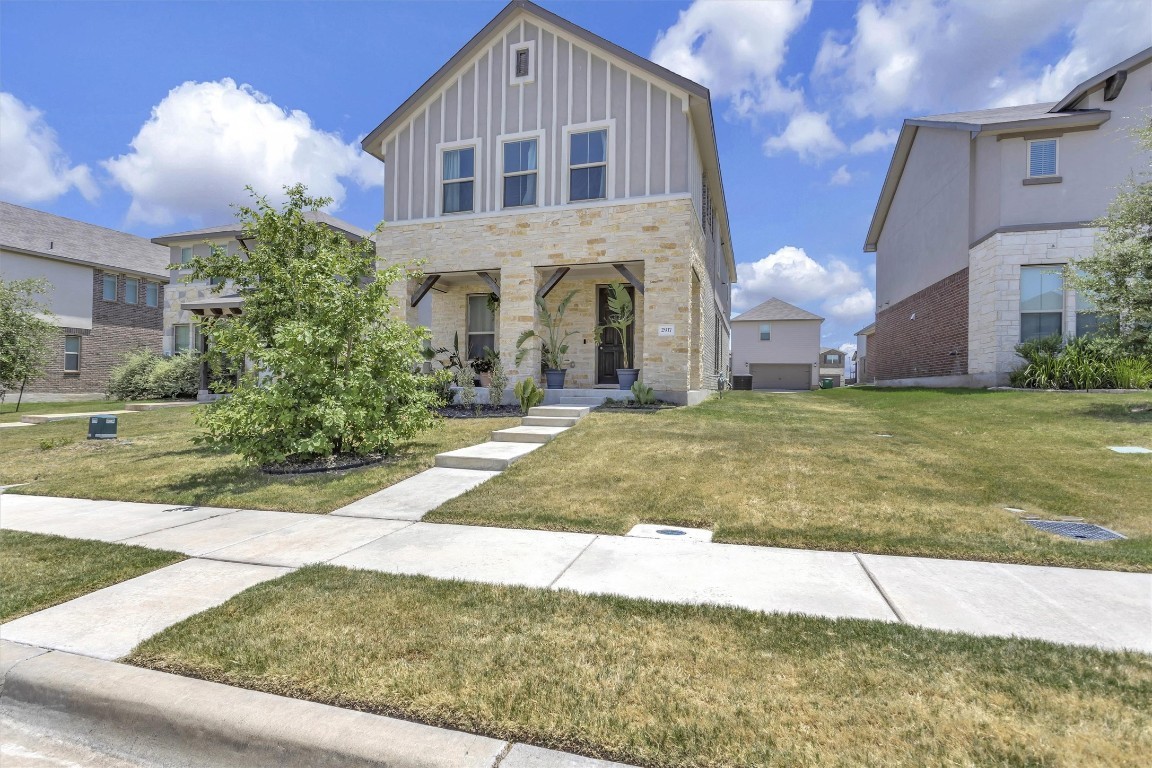 a view of a house with a yard