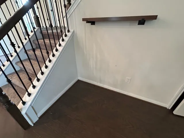 a view of an empty room with stairs