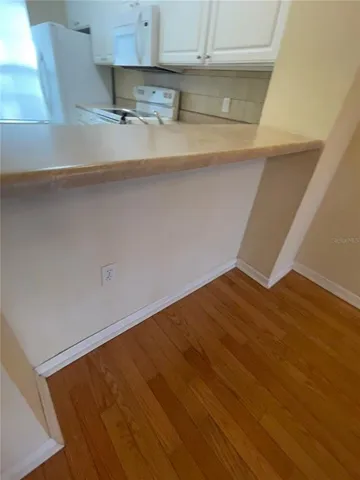 an empty room with wooden floor