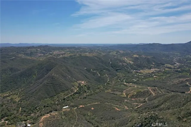 a view of a yard with wooden floor and mountain view