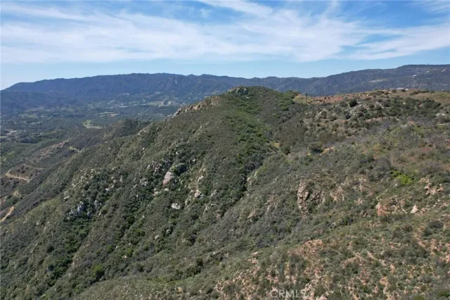 a view of a city with mountains in the background