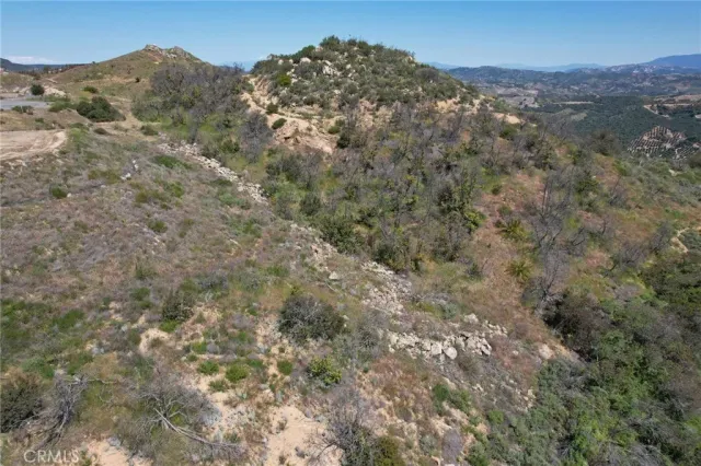 an aerial view of residential house and green space