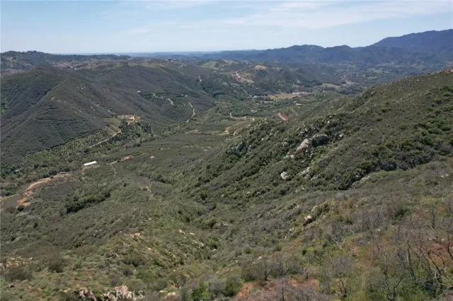 a view of mountain with sunset