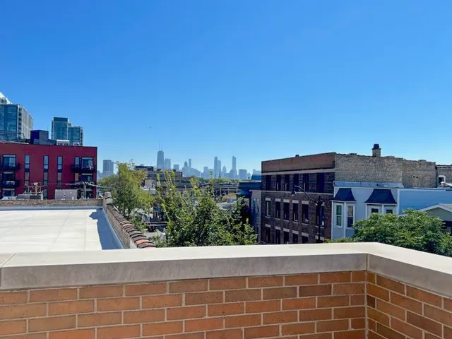 a view of a city that has tall buildings