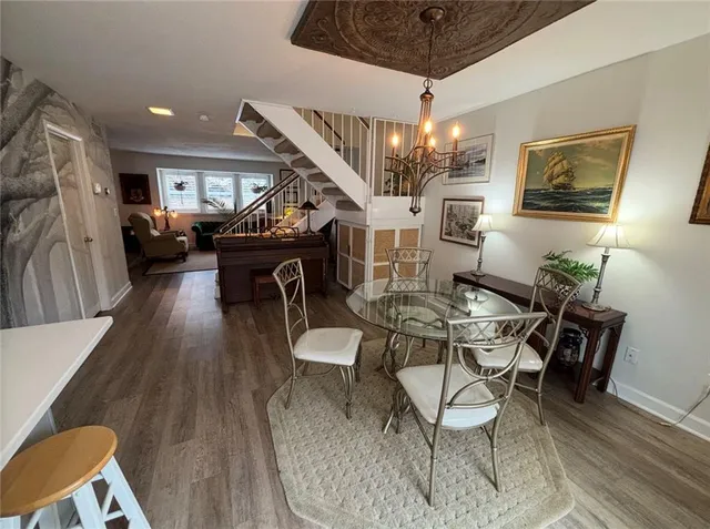 a kitchen with a refrigerator a stove a sink and a window