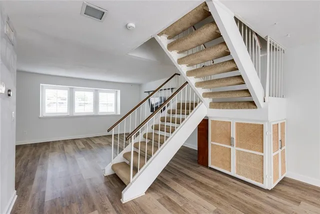 a view of room with window and a ceiling fan
